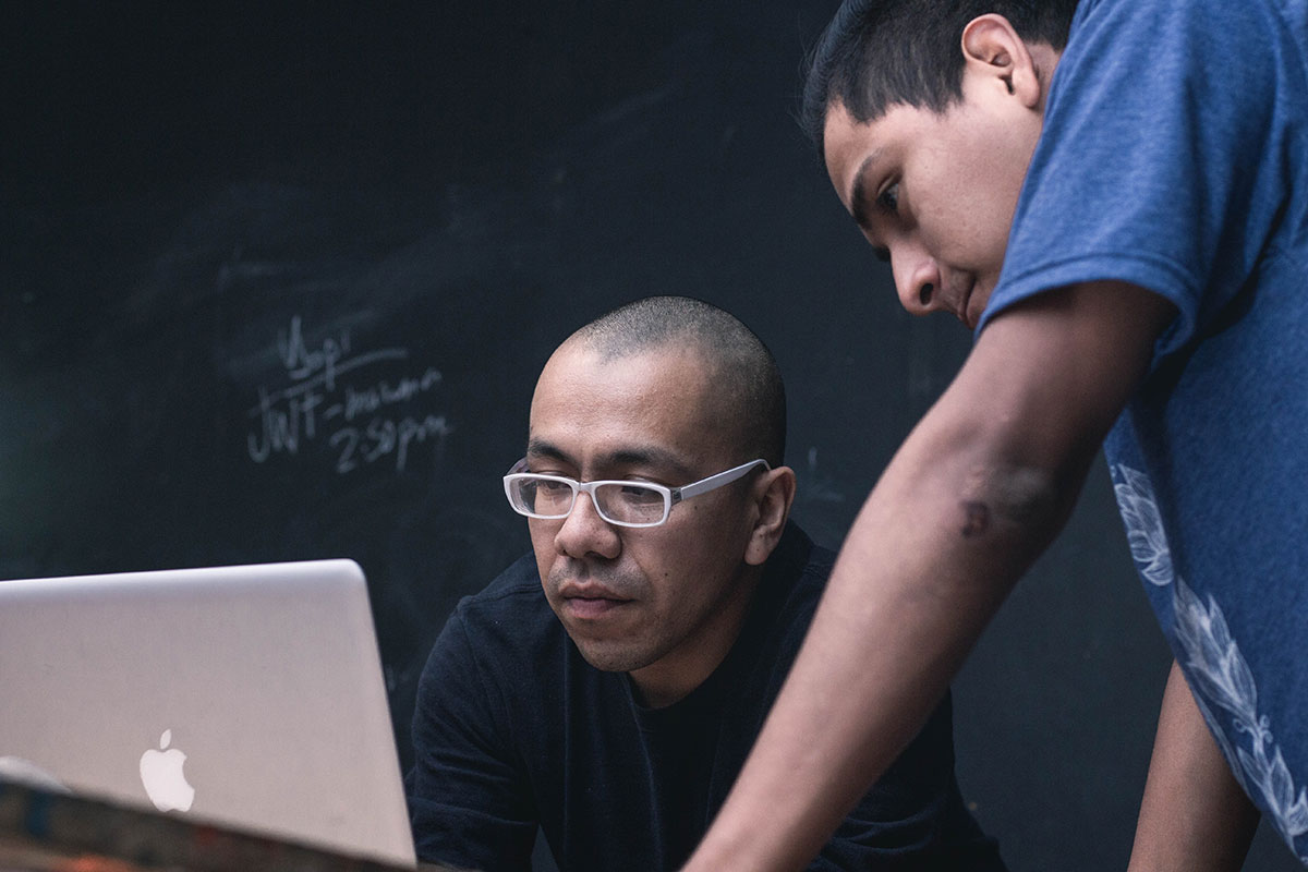 People looking at a computer