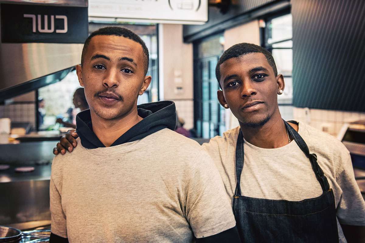 Two men working in a kitchen