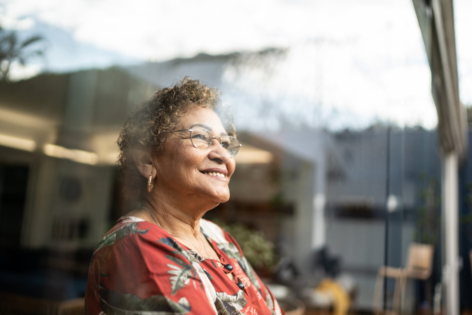 woman looking out window