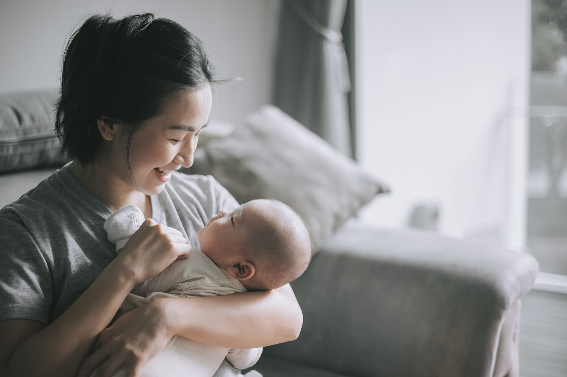 woman bottle feeding a baby