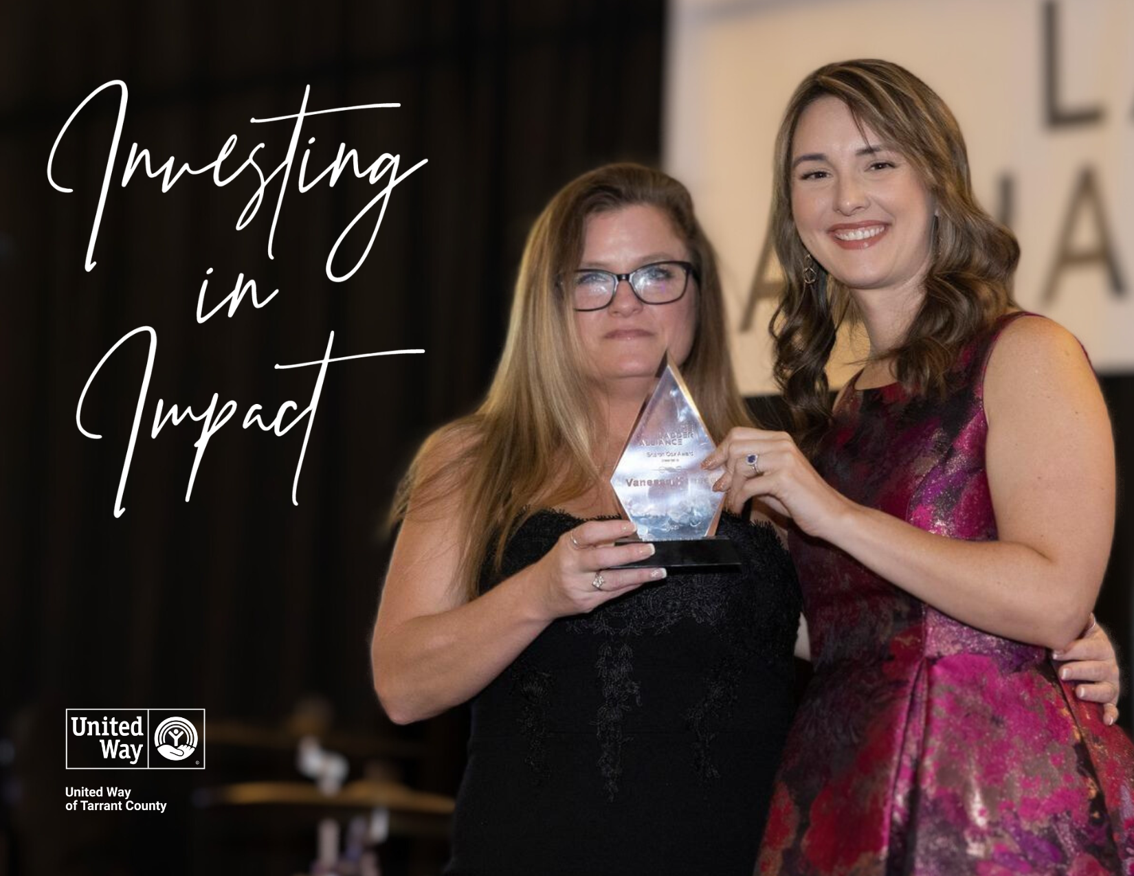 Vanessa Keesee receives the Sharon Cox award from Kathryn Thalken, Executive Director for the Ladder Alliance.