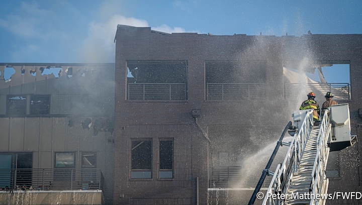 Firefighters putting out fire at The Cooper apartments in Fort Worth. Photo by Peter Matthews, Fort Worth Fire Department