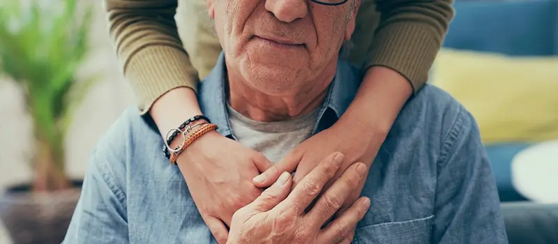 Person being hugged from behind