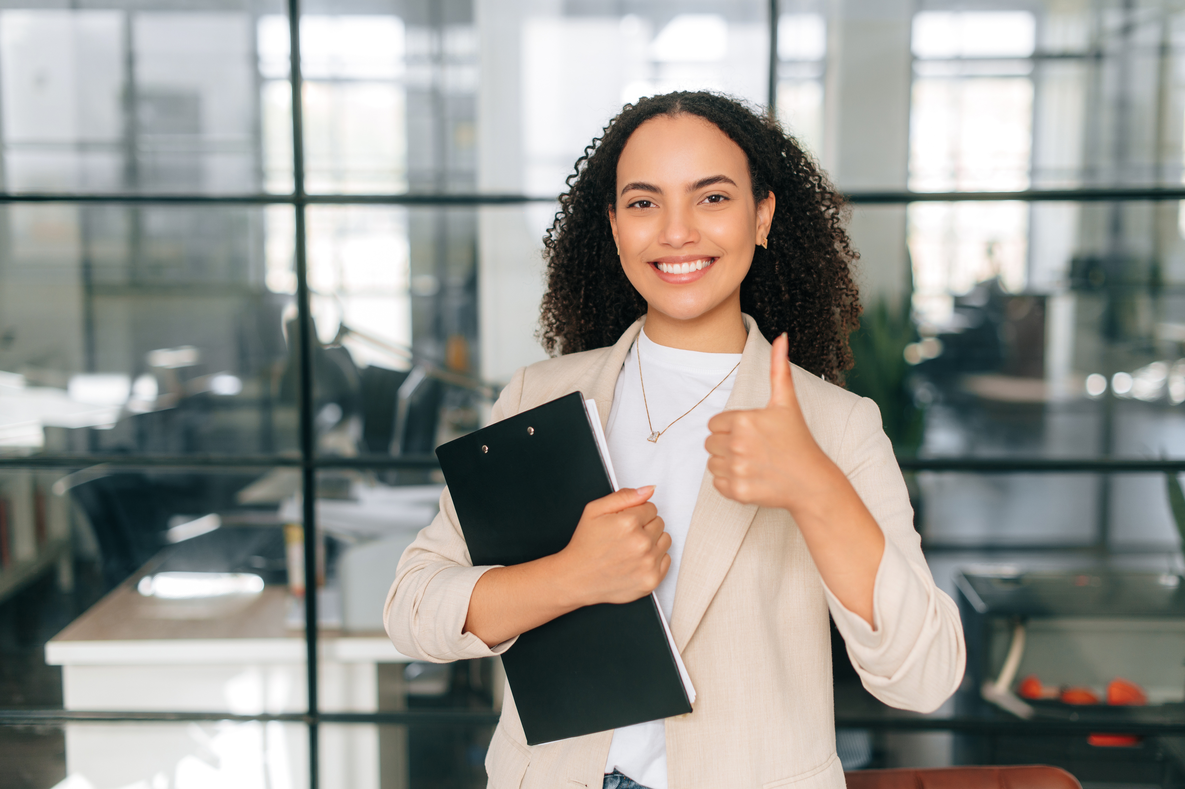 Woman smiling with clipboard