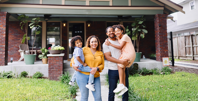 Family in front of house