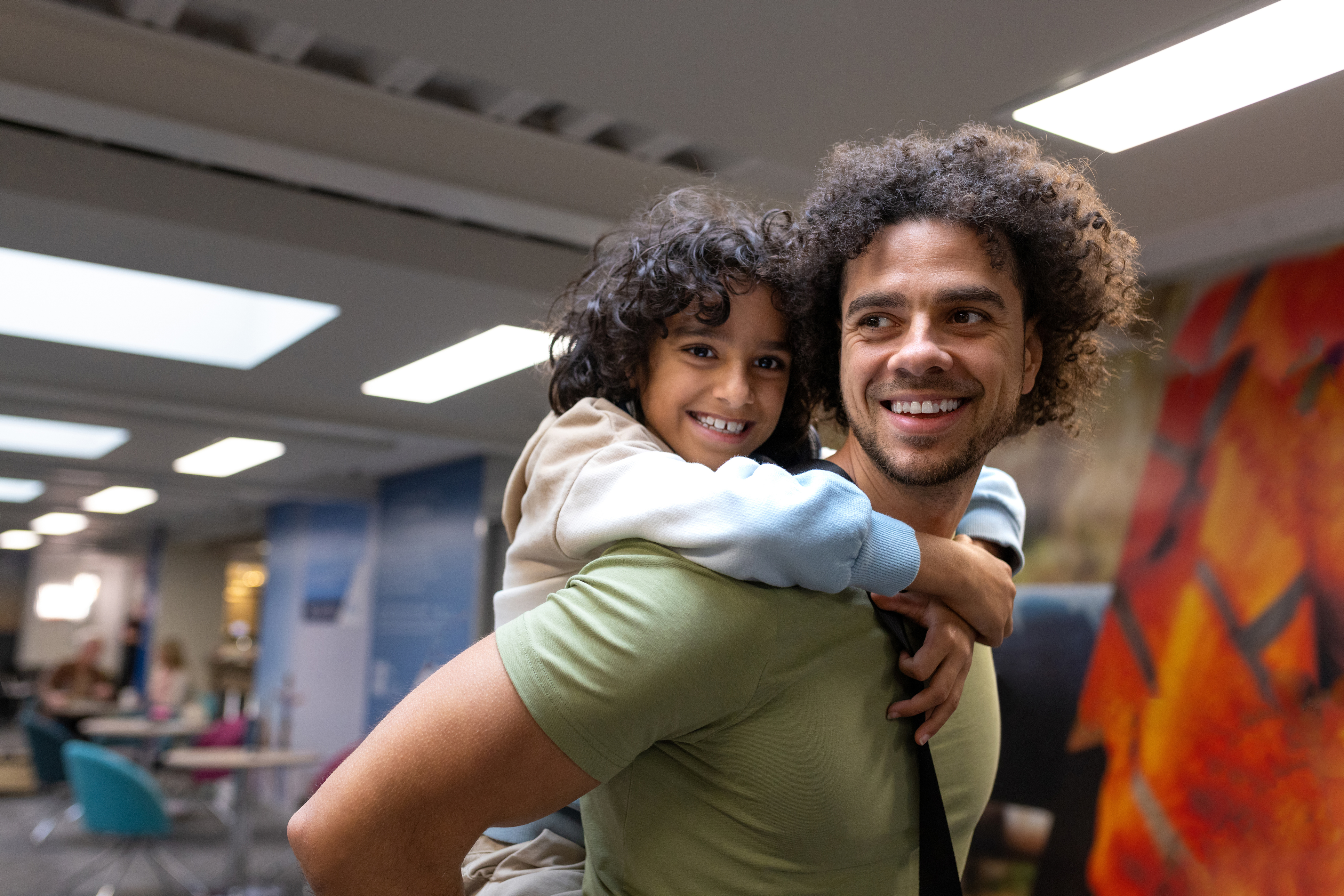 Father giving son a piggyback ride.