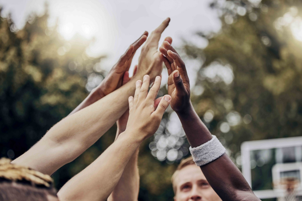 Hands in center of group