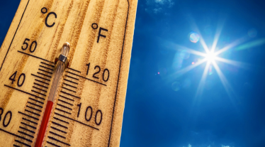 Thermometer Sun Sky 40 Degres. Hot summer day. High Summer temperatures in degrees Celsius and Farenheit.