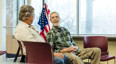 Two older veterans conversing