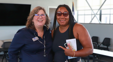 Nakeesha Richmond-Moore stands with Deanna W. Titzler.