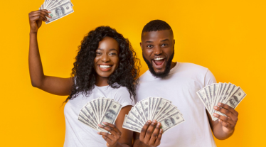 Two people holding money