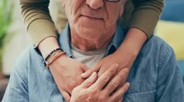 Person being hugged from behind